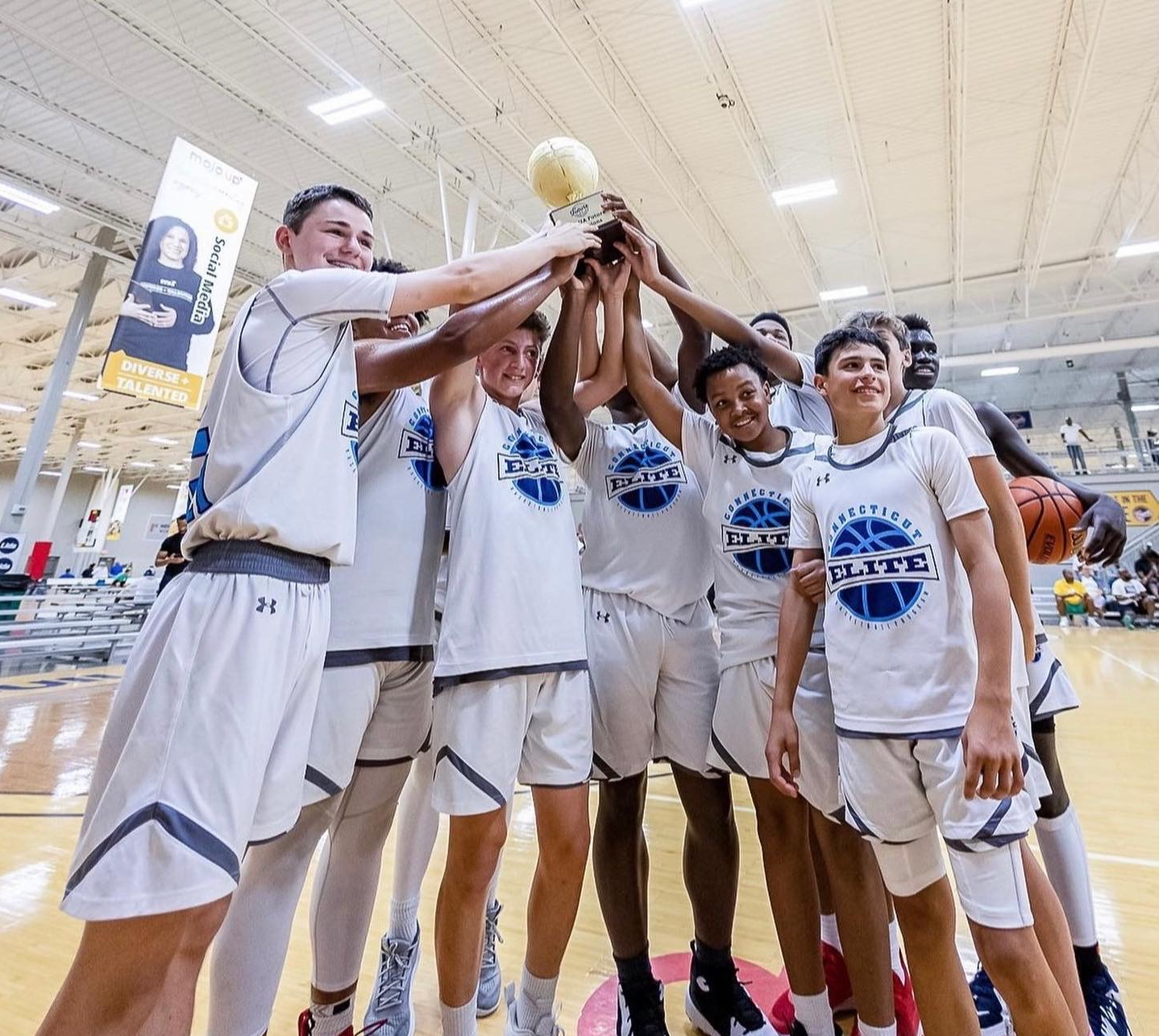 Connecticut Elite team celebrating a championship trophy