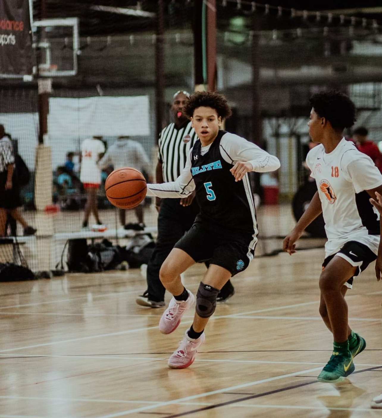 Connecticut Elite player driving the ball up the court